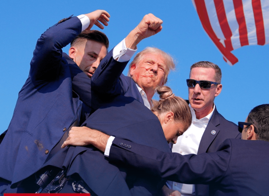 Trump Raising His Fist with blood on his face and ear from being shot