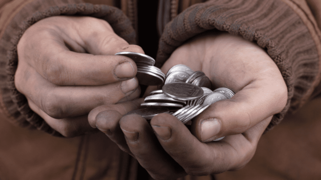 beggar's hands holding money