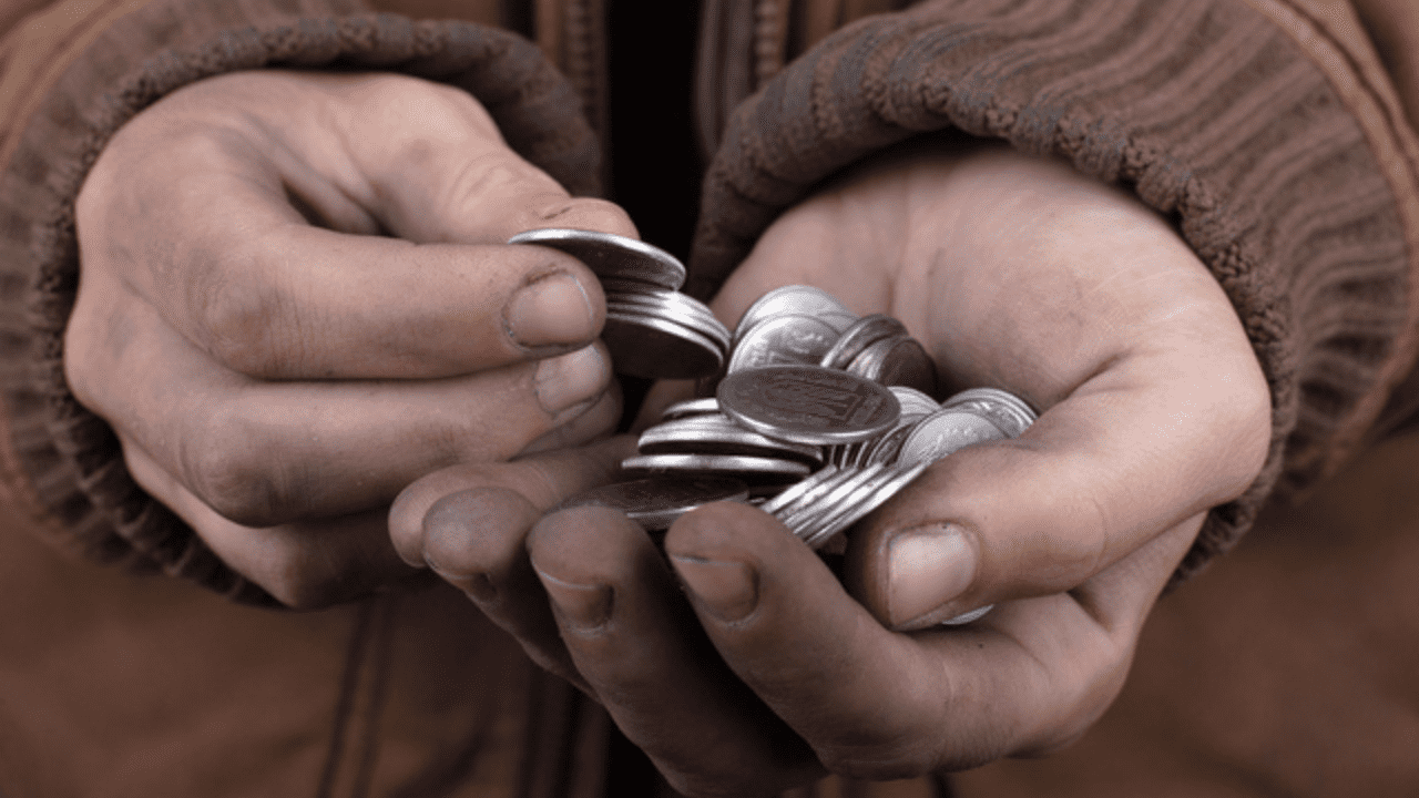 beggar's hands holding money